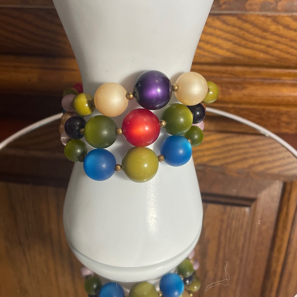 Colorful Beaded Bubble Wrap Bracelet with an iridescent reflective quality.